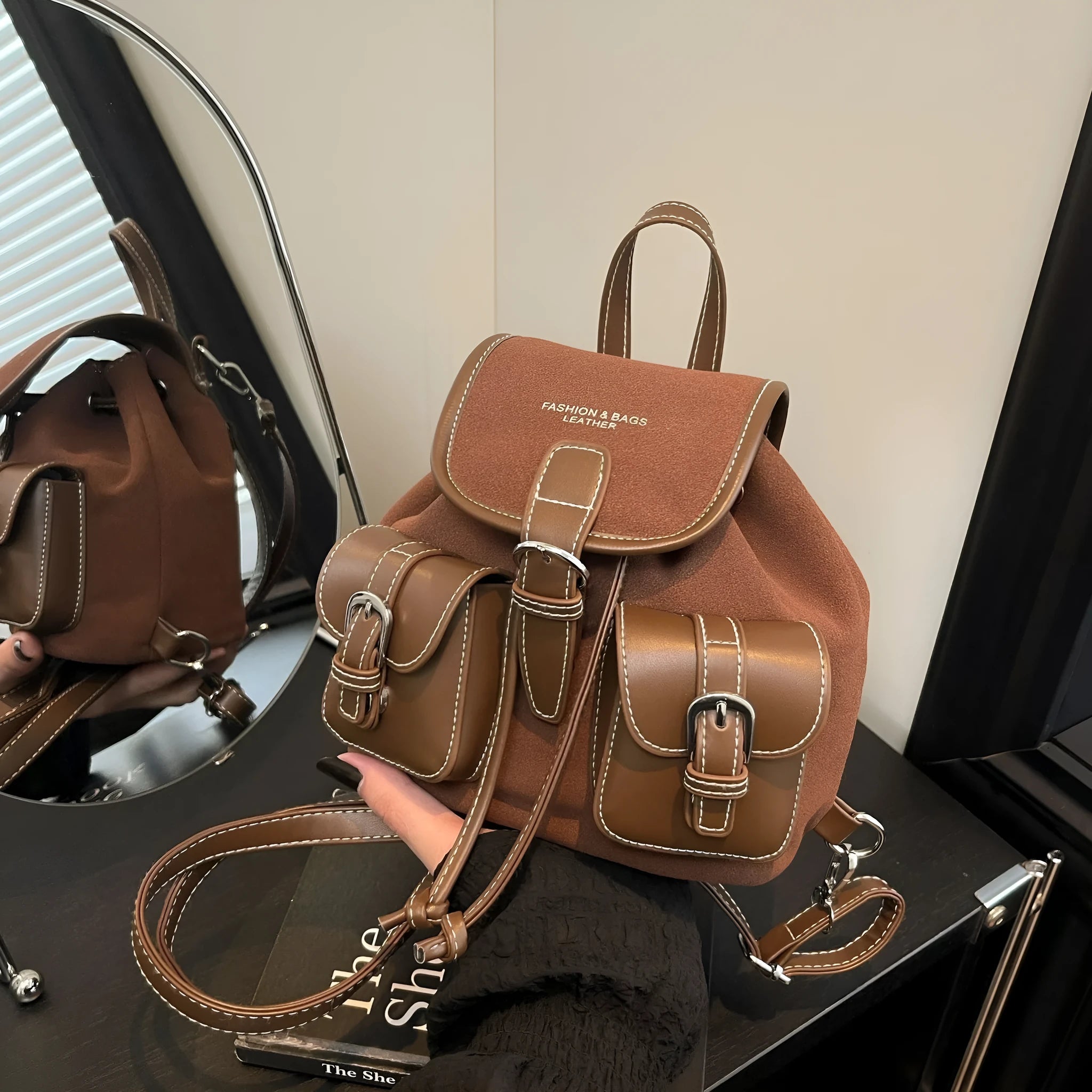 Fashionable all-match PU clamshell backpack in black with contrast stitching, daily commuter bag