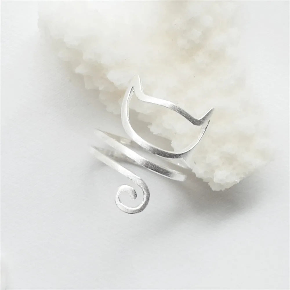 S925 silver adjustable cat ring with brushed winding collar detail on light background