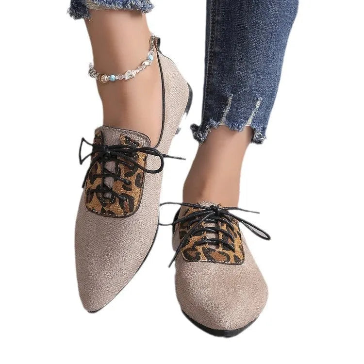 Beige leopard print pointed toe court shoes for women with a low block heel, shown in a plus size fit.