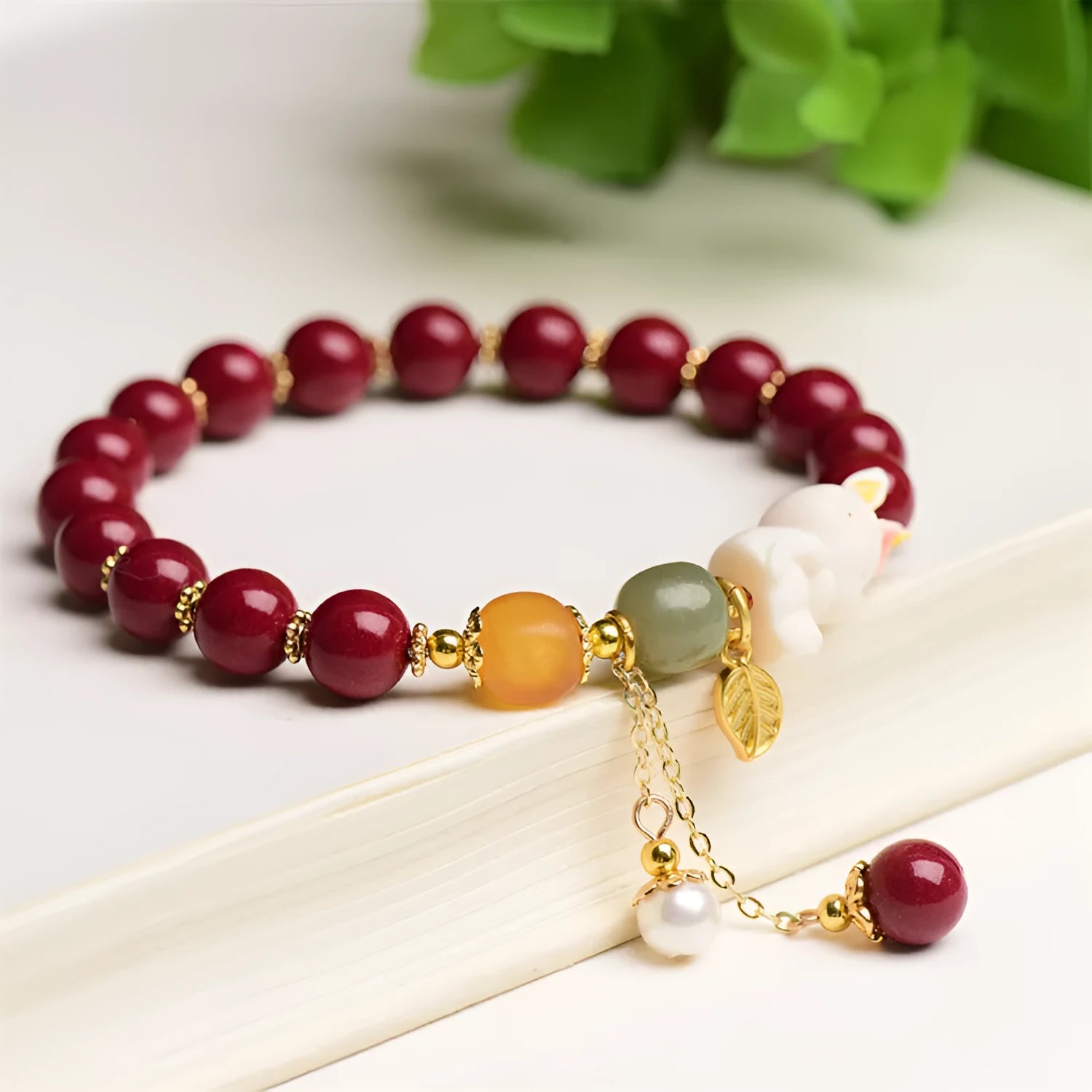 Tian Yu natural cinnabar bracelet with rabbit design in 8mm or 10mm sizes
