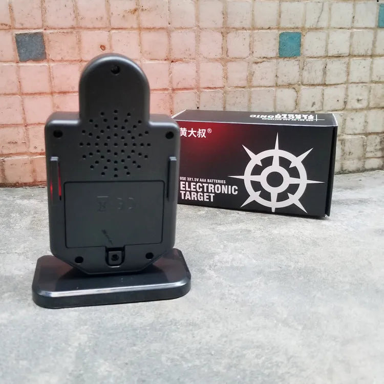 Laser target with light and sound effects in plastic casing, dimensions 9cm by 4.7cm by 12.8cm