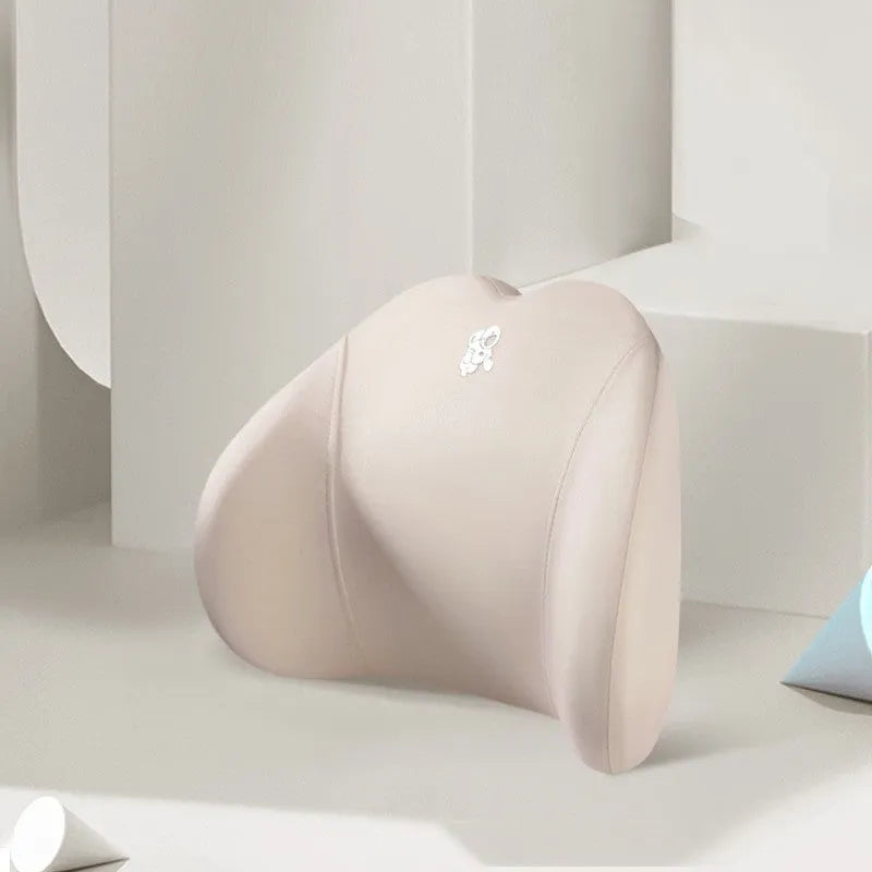 Heart-shaped car pillow in choice of colours, shown as headrest and lumbar support on a car seat.