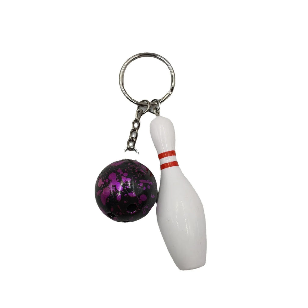 Mini bowling ball keychain in four colour options: dark red, blue, purple, green