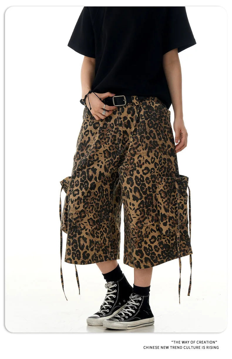 Women's high-waisted leopard print cropped trousers with a loose straight leg and button fly.