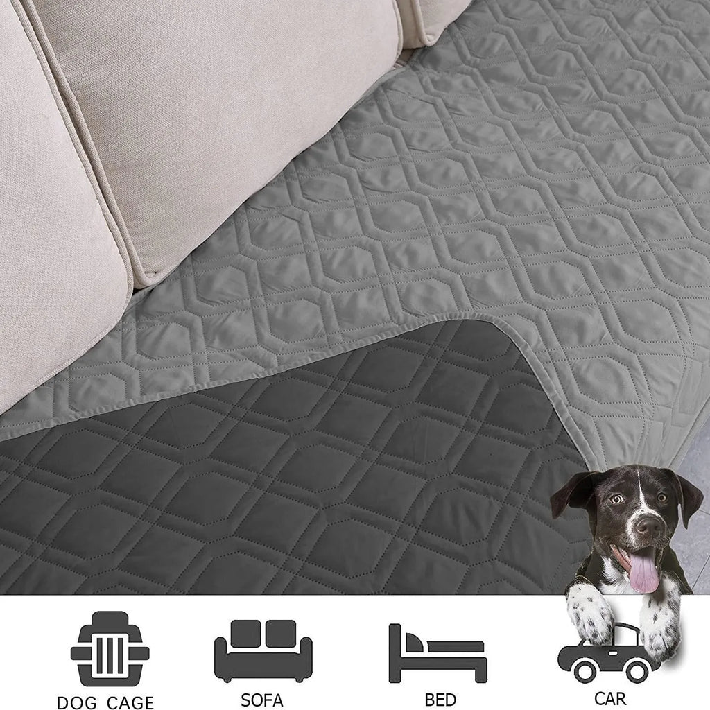 Reversible waterproof dog blanket laid on a sofa, showing two colour options.