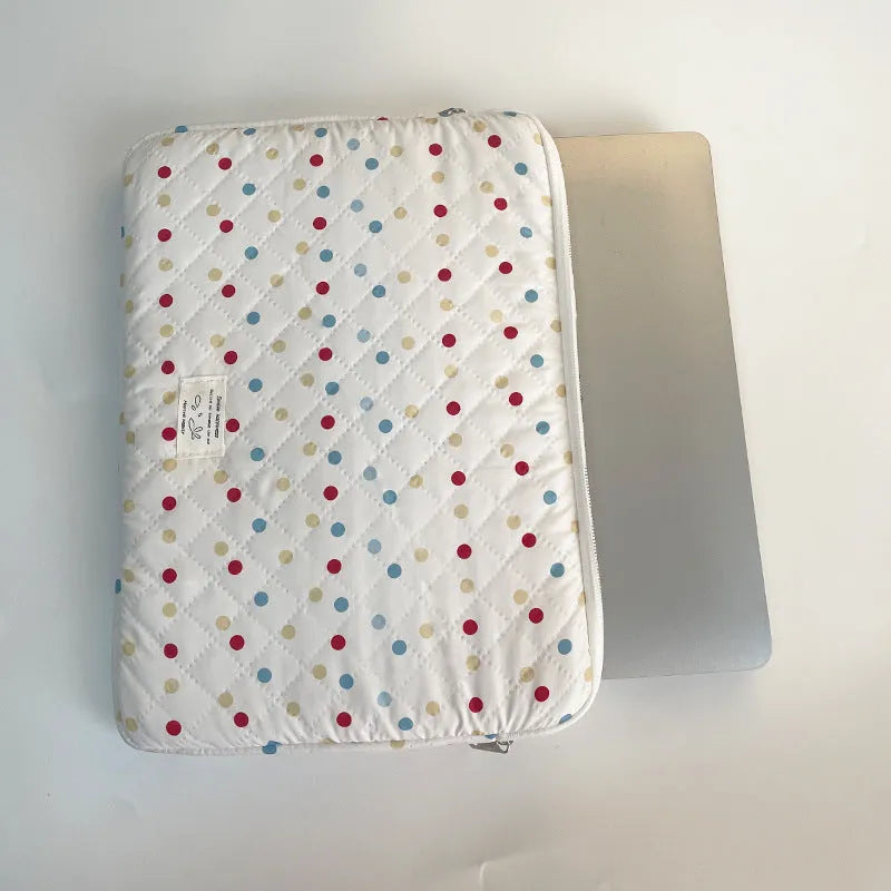 Women's polka dot laptop bag in polyester with breathable construction showing size options