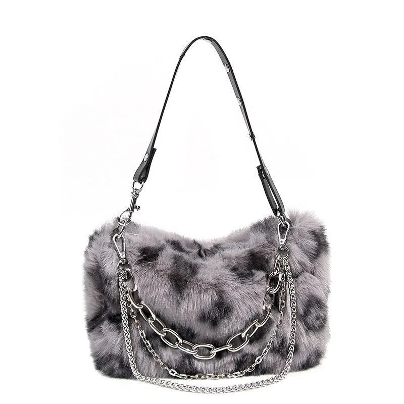 Plush luxury-style chain bag in apricot with leopard print and gold-tone chain, horizontal rectangular shape, soft texture.