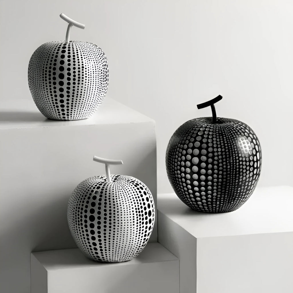 Solid resin apple figurine with smooth apple finish, 17cm high, in black colour on a shelf