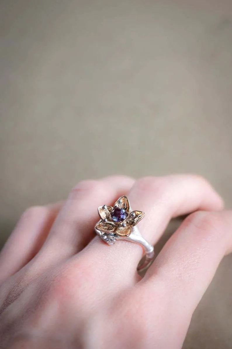 Silver two-tone floral geometric women's fashion ring made from alloy.