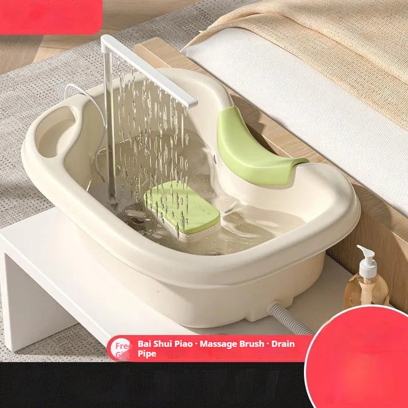 Portable shampoo basin set with circulating water pump and cushioned head support in light pink