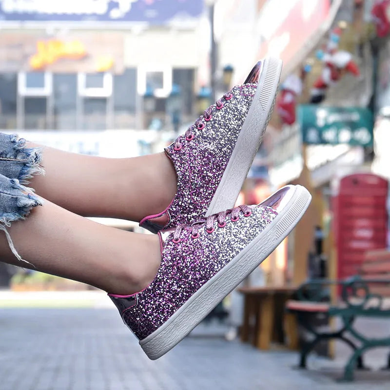 Women's low-top casual shoes with colourful sequin upper, round toe, and lace-up front in black, gold, or pink.