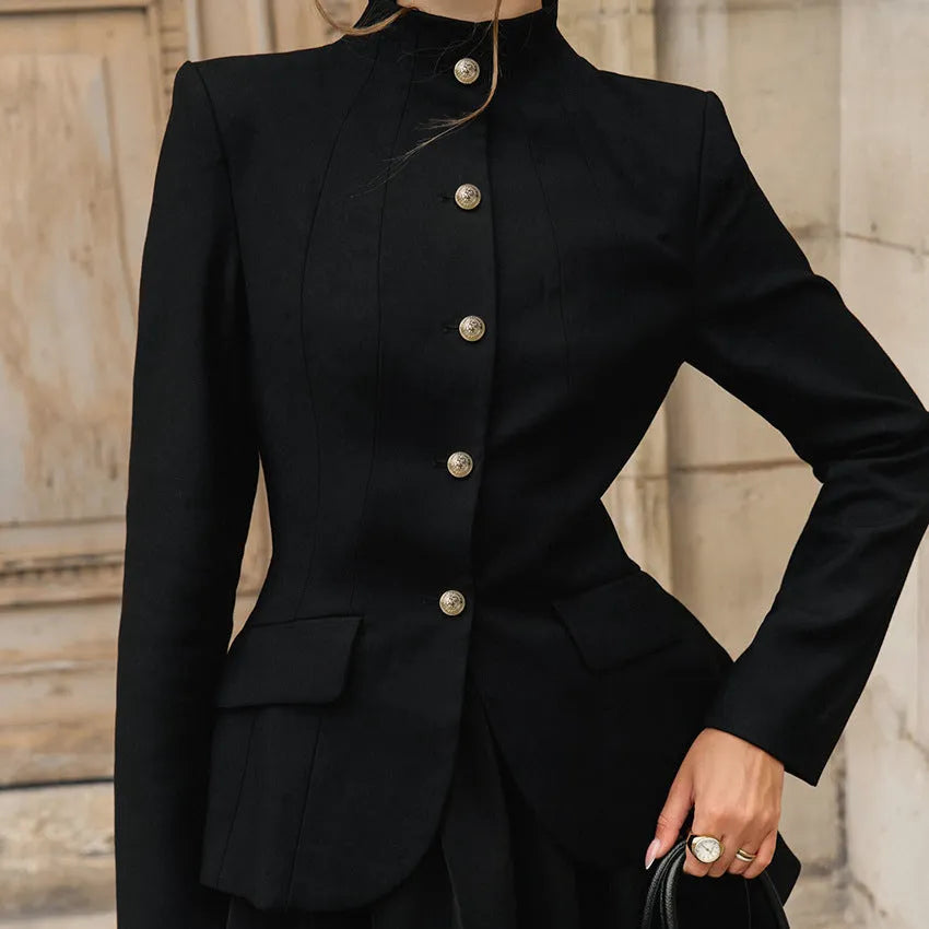 Women's black solid colour stand collar suit set with blazer and short dress on display