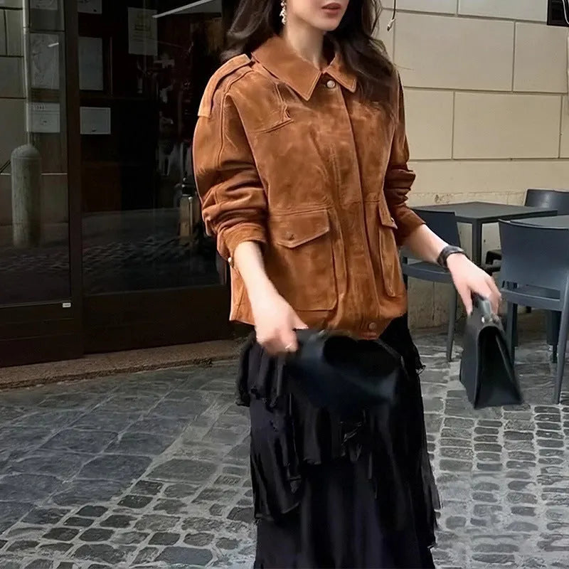 Brown suede-look polyester women's coat with regular sleeves on a hanger.