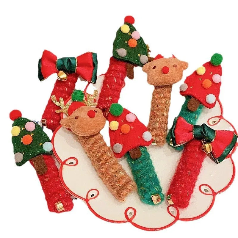Children Christmas hair ties with red bell, green tree, khaki elk, and red tree designs on a light background