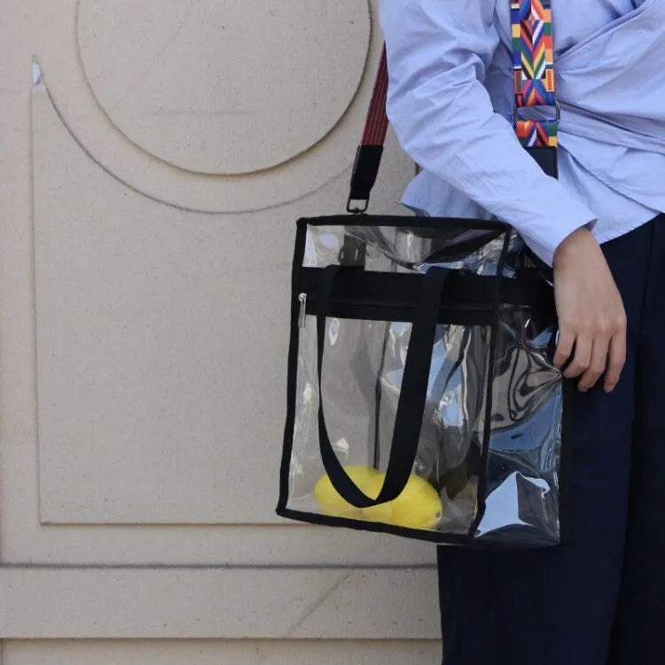 Women's transparent PVC crossbody messenger bag with a black side net pocket, shown in a horizontal square shape.