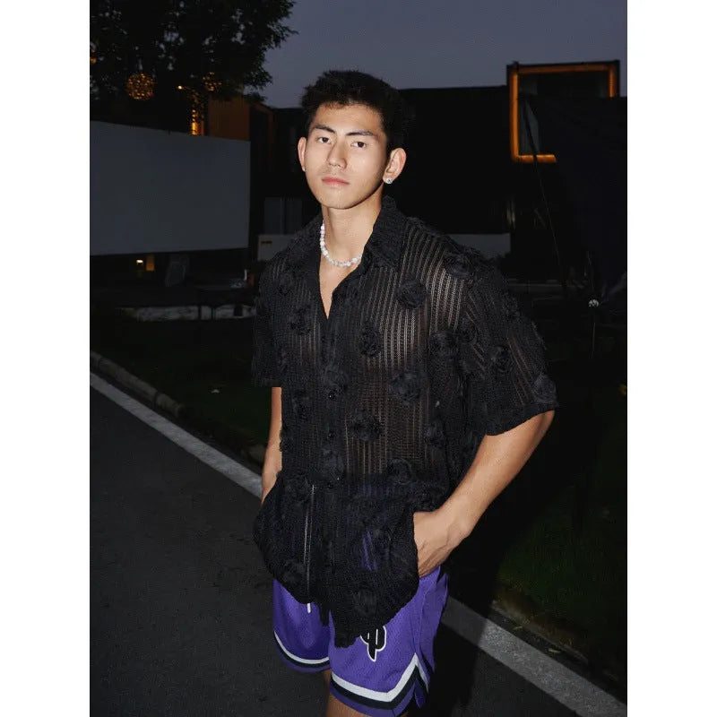 Man's loose-fit short-sleeve shirt with a white and black three-dimensional floral print on heavyweight fabric.
