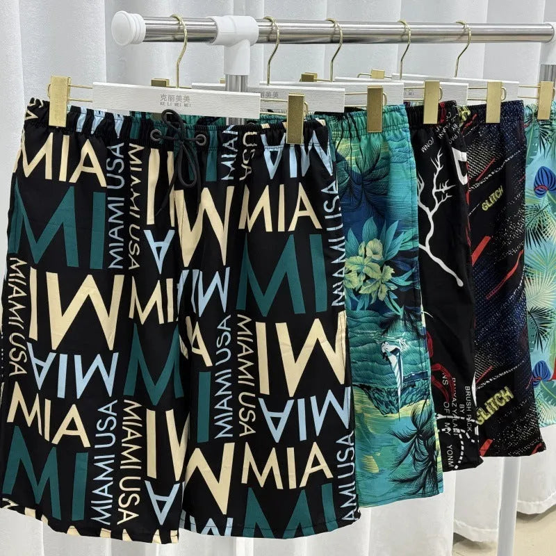 Men's loose fit beach trousers with floral pattern and elastic waistband for summer wear