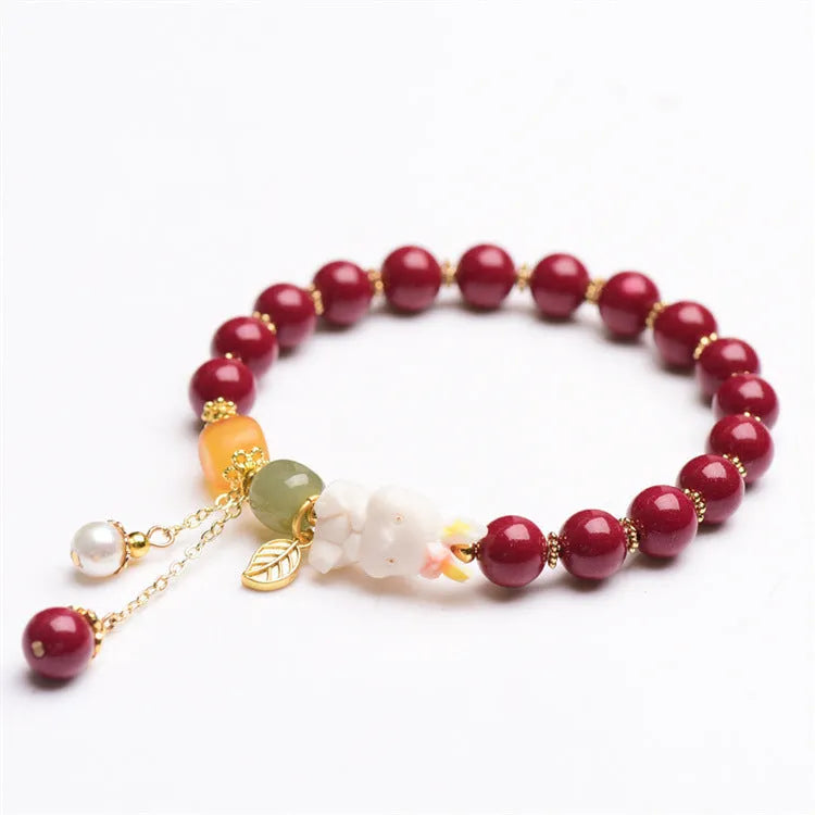 Tian Yu natural cinnabar bracelet with rabbit design in 8mm or 10mm sizes
