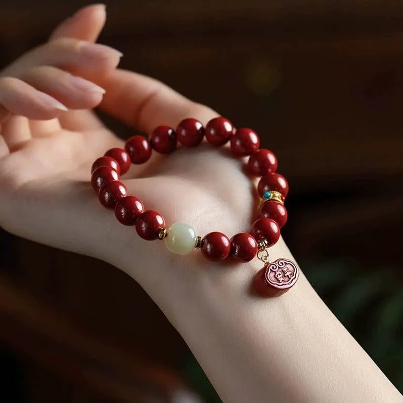 Natural cinnabar Emperor Sandstone bracelet with Ping An Fu Lu design in 8mm or 10mm bead size