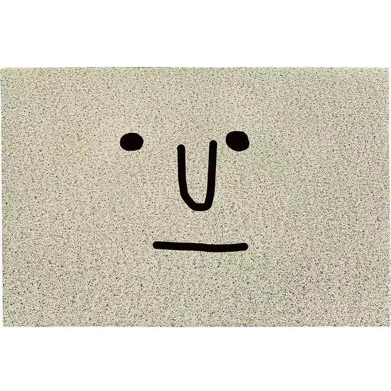 Cartoon facial expression PVC floor mat with Mr. Big Nose geometric pattern, shown in a square shape with a wire ring border.