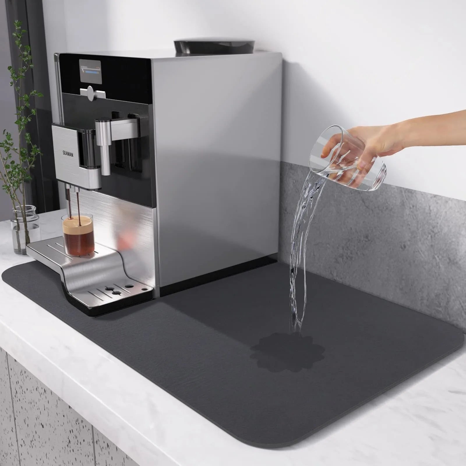 Black super absorbent rubber-backed kitchen drain mat on a countertop
