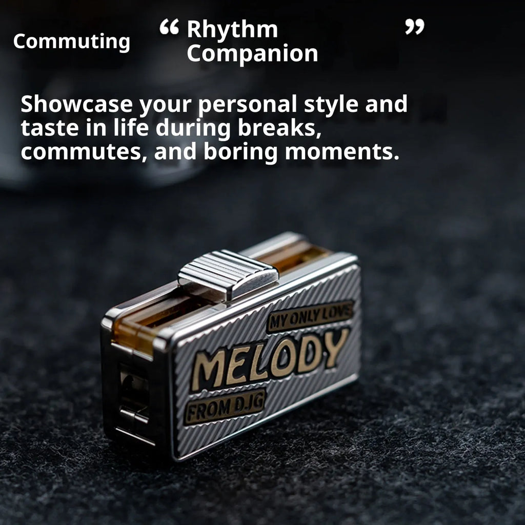 Titanium alloy mechanical scale push EDC fingertip decompression toy in Melody colour shown on a desk