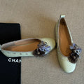 Women's silver buckle Mary Jane casual shoes with a flat rubber sole and sheepskin upper.