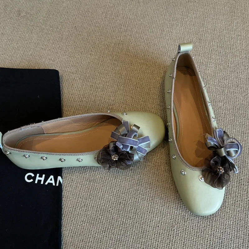 Women's silver buckle Mary Jane casual shoes with a flat rubber sole and sheepskin upper.