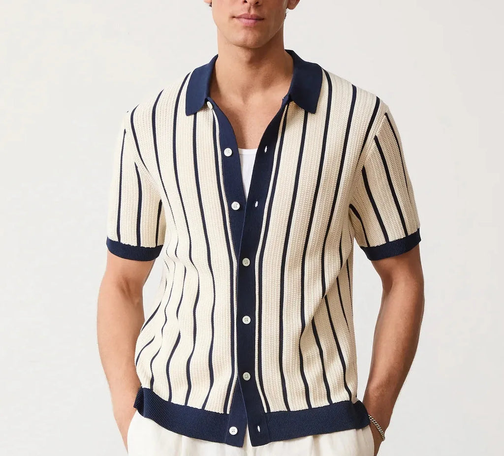 White men's lapel knitted short sleeve shirt with asymmetric stripe design on a hanger.