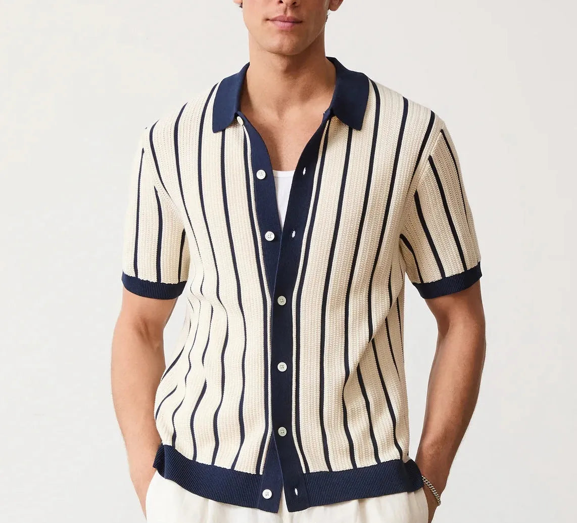 White men's lapel knitted short sleeve shirt with asymmetric stripe design on a hanger.