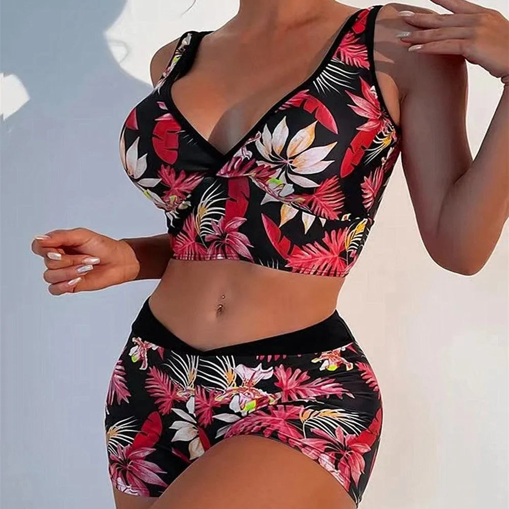 Women's two-piece printed swimsuit with sleeveless top and briefs-style bottoms in a multi-colour design.