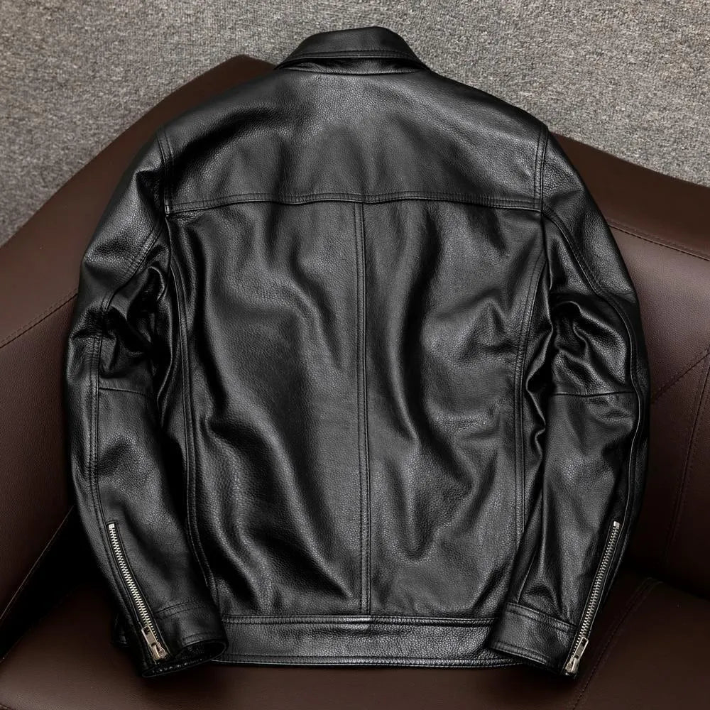Men's plus size black retro lapel leather jacket with loose fit on hanger.