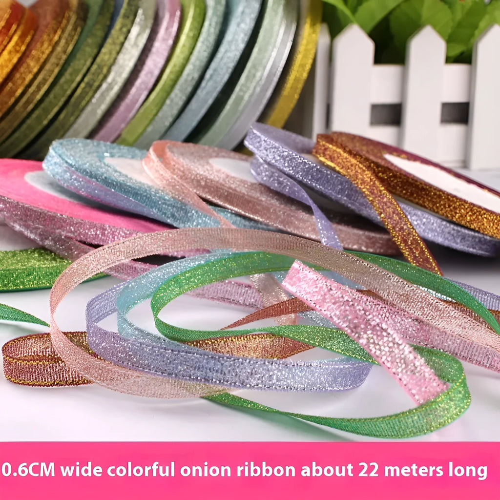 Roll of narrow 0.6cm wide polyester gift ribbon in a choice of colours including metallic gold and silver.
