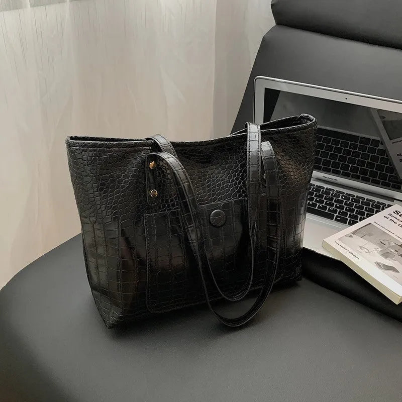 Retro large capacity single-shoulder handbag in brown, soft PU material with stitching detail, horizontal square shape.