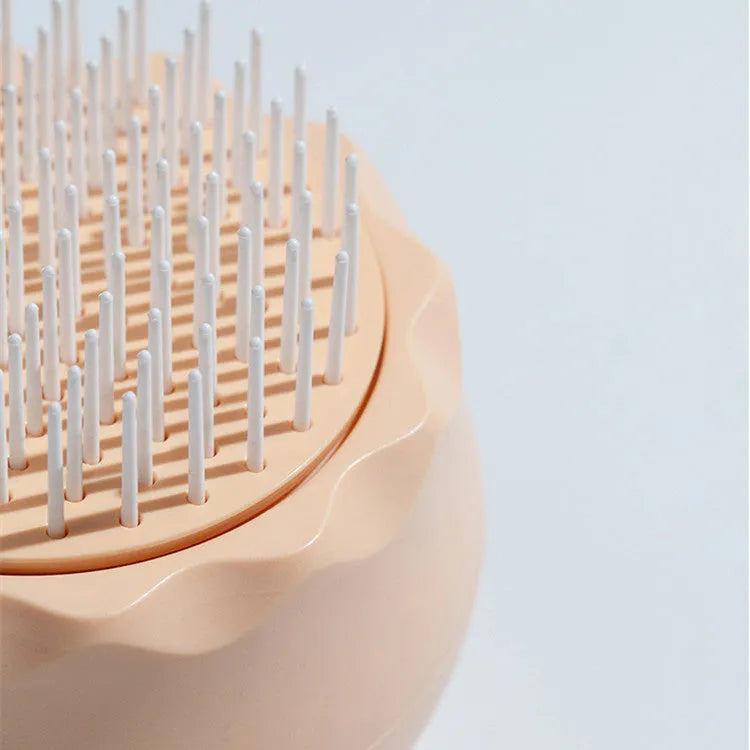 Floating massage pet needle comb with soft silicone brush head for cat hair cleaning, 75x75x73 mm, in orange pink colour