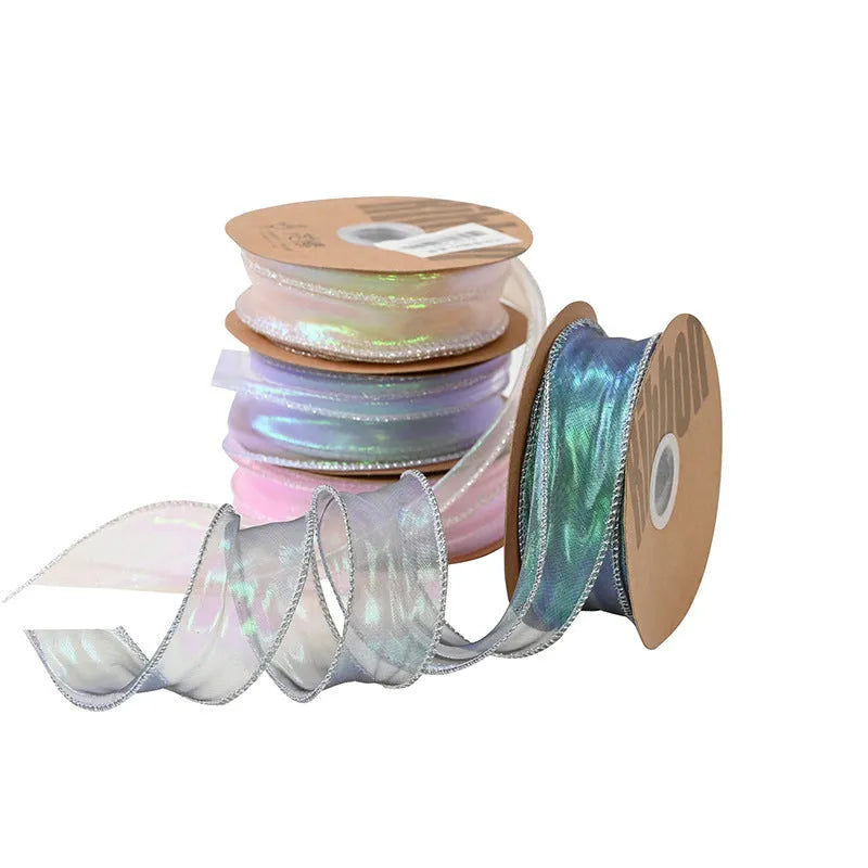Roll of colourful wave fishtail yarn ribbon in illusion champagne colour, showing textured pattern and 4cm width.
