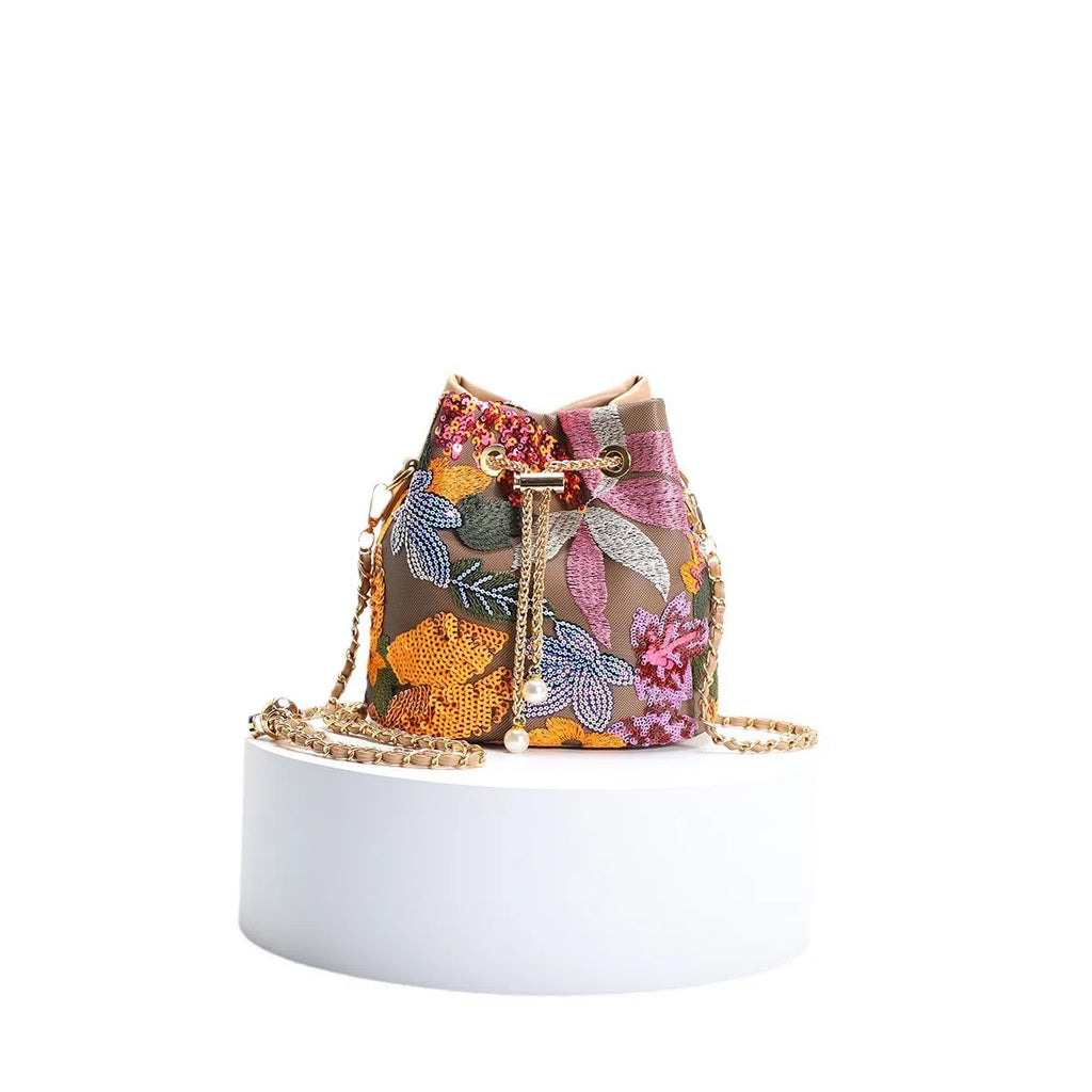 Bucket bag with mesh patchwork contrasting colours drawstring and chain strap in beige PVC material