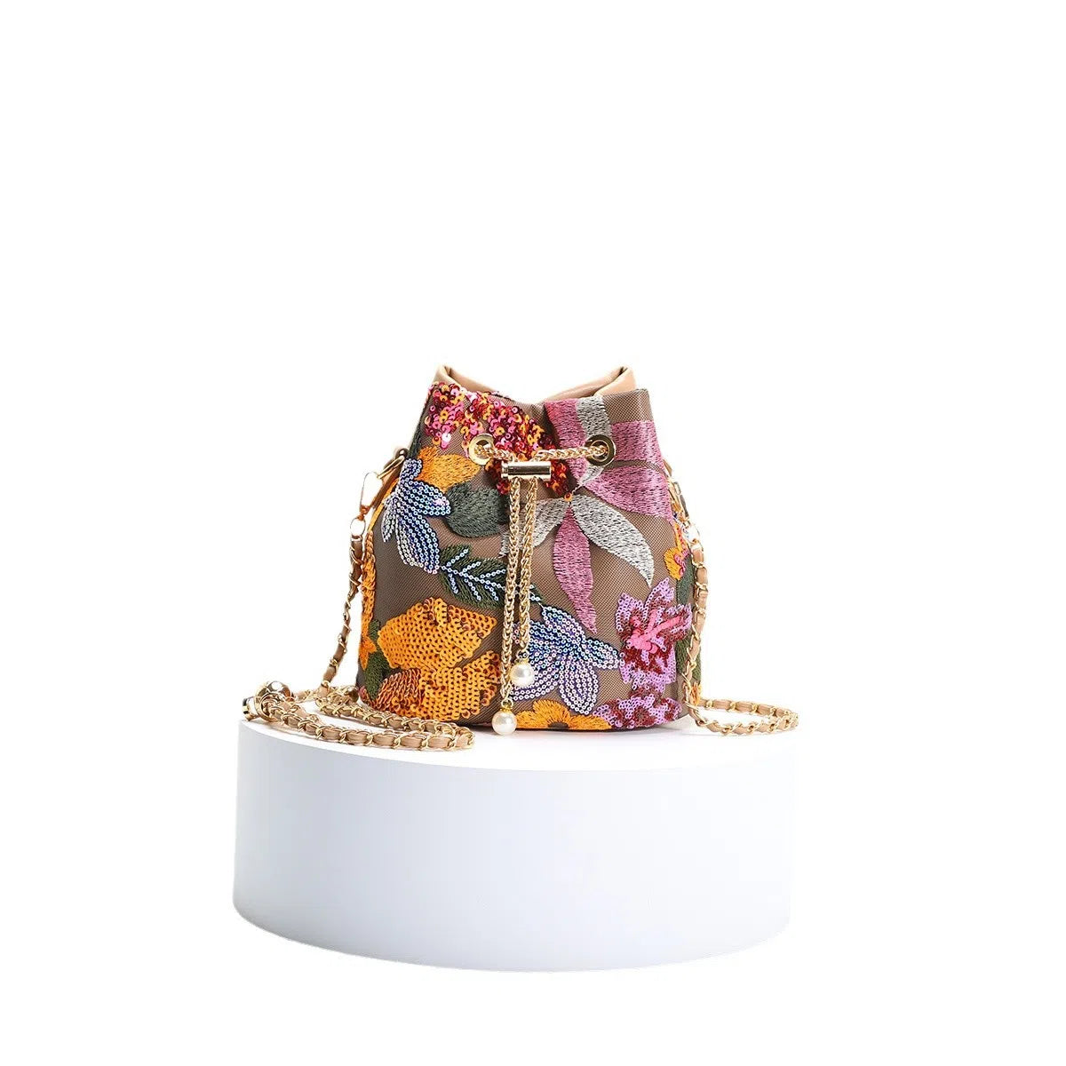 Bucket bag with mesh patchwork contrasting colours drawstring and chain strap in beige PVC material