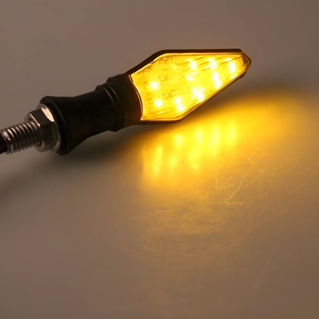 Motorcycle modified turn signal light with double-sided luminous function and yellow/blue light options