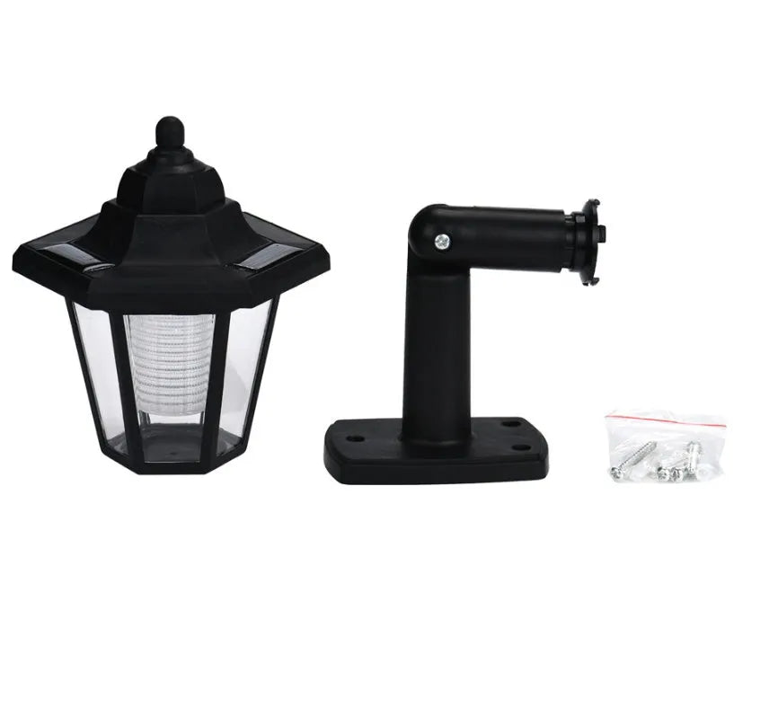Black hexagonal solar wall light with IP44 waterproof rating for outdoor garden and pathway illumination
