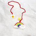 Handmade crocheted avocado rainbow flower car pendant in wool with cartoon styling