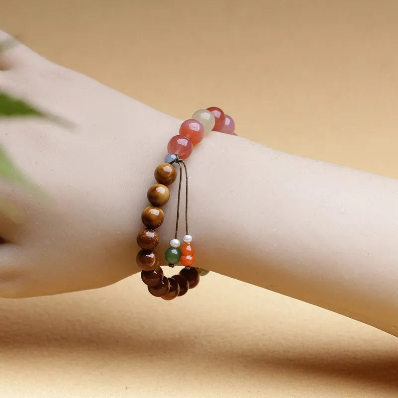 Women's 8mm agate bracelet with diamond-shaped beads and persimmon elements