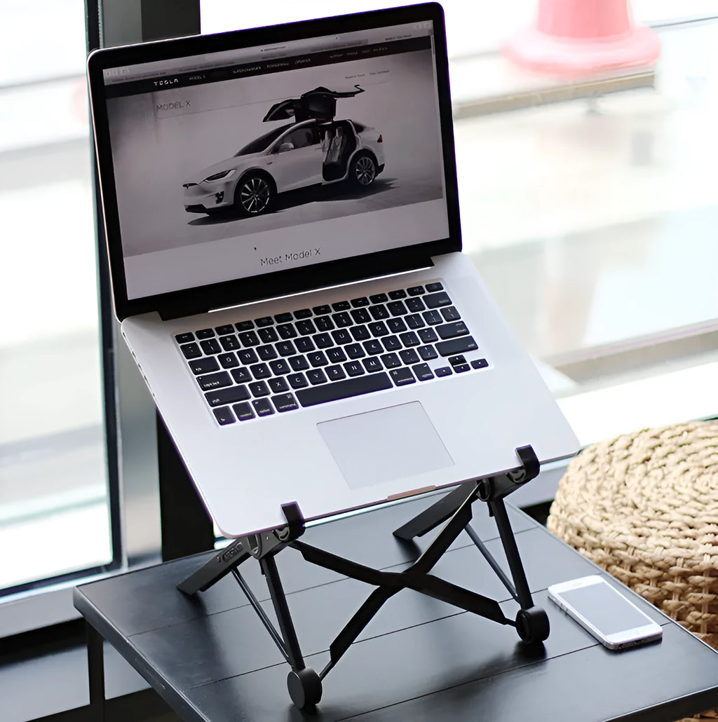 Black folding laptop computer stand with reinforced nylon construction showing folded position at 35.4cm length