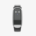 Black and white ultrasonic mosquito repellent bracelet with USB charging cable on wrist
