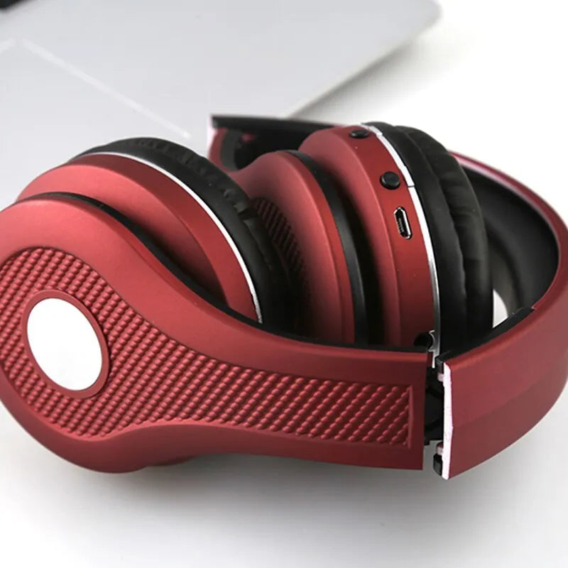 Metallic bluetooth headset in black, blue, gold, or red with head-mounted design and bilateral earpieces