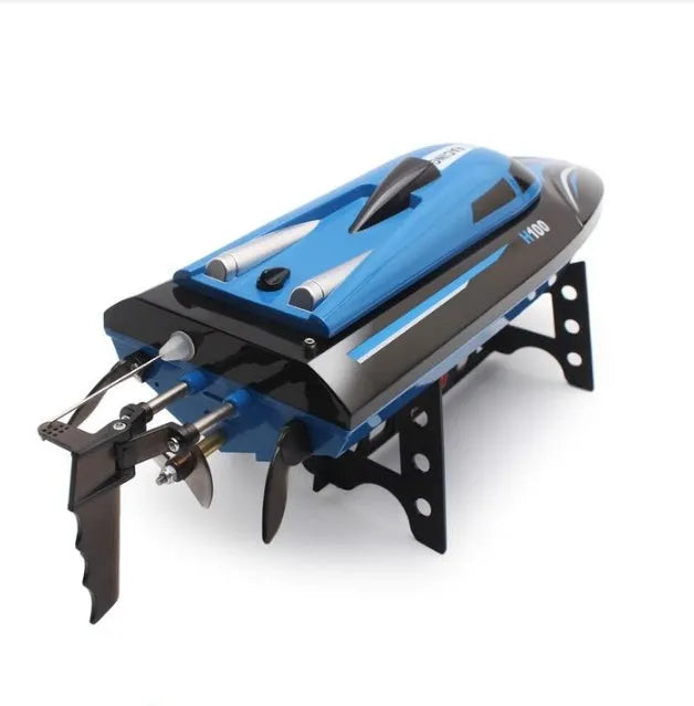Blue speed racing RC boat on water, with remote control transmitter featuring LCD screen