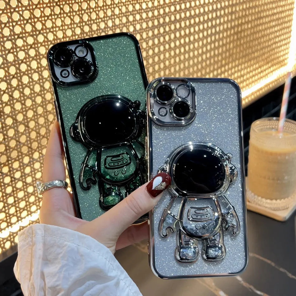 Glitter quicksand iPhone case with electroplated astronaut spaceman design and rhinestone details