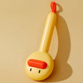 Small yellow duck comb pet grooming brush with open sections and needle bristles