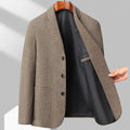 A man wearing a simple, loose-fit solid-colour woolen coat suitable for spring or autumn.