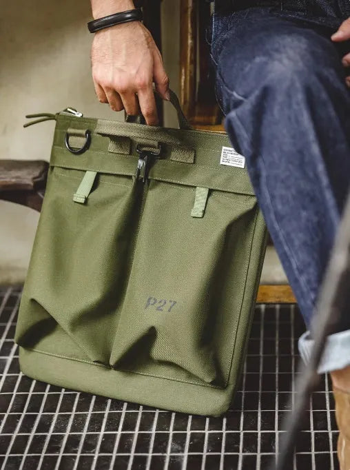 Medium canvas crossbody messenger bag in military green colour with laptop compartment and phone pocket